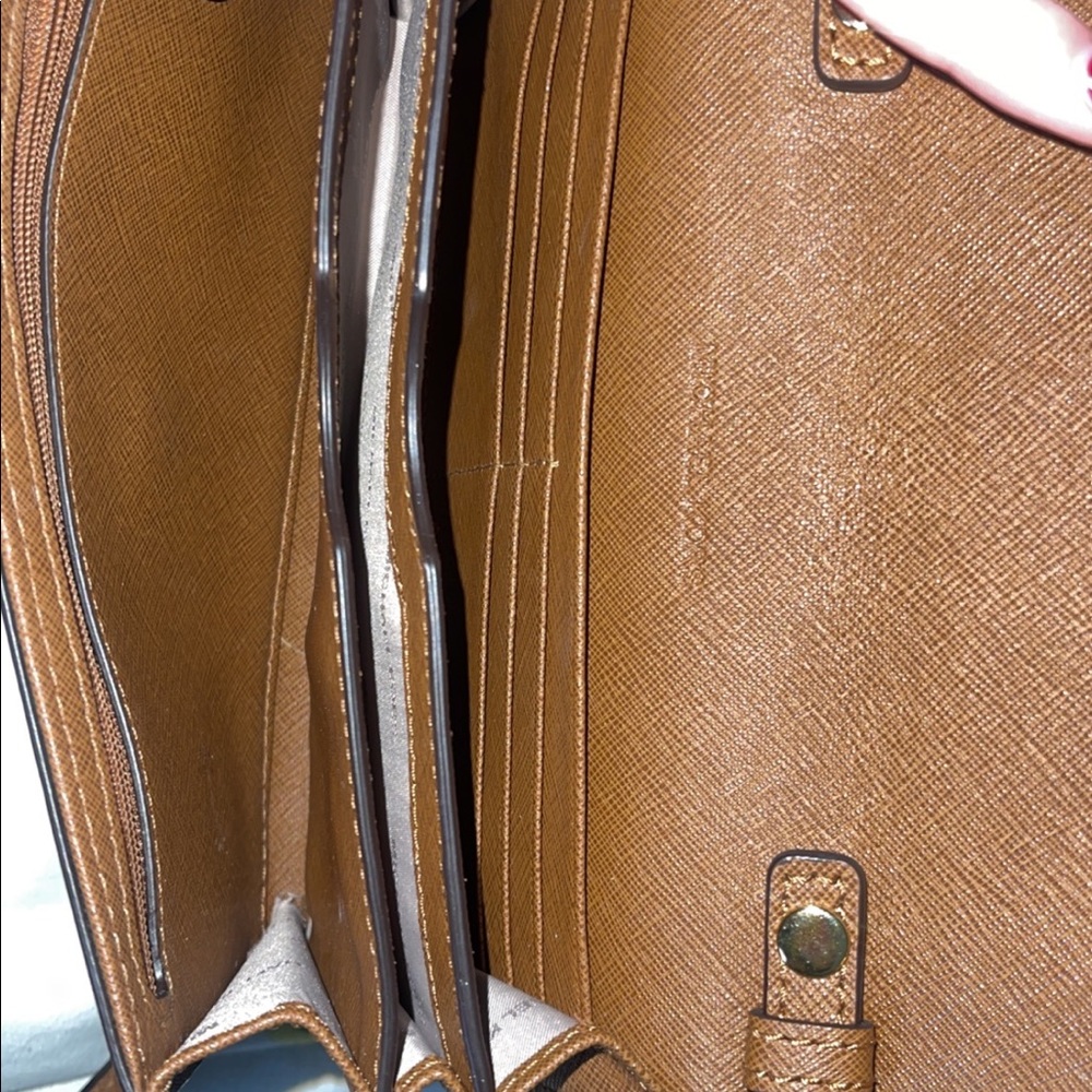 Michael Kors purse over the shoulder. chocolate brown color.